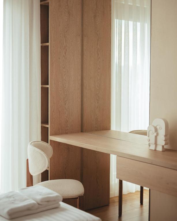 Desk and wardrobe corner with boucle chair