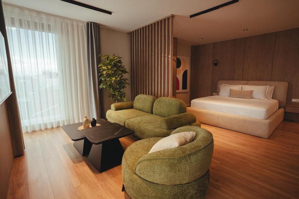 Family Suite — bed and lounge separated by wood slat divider
