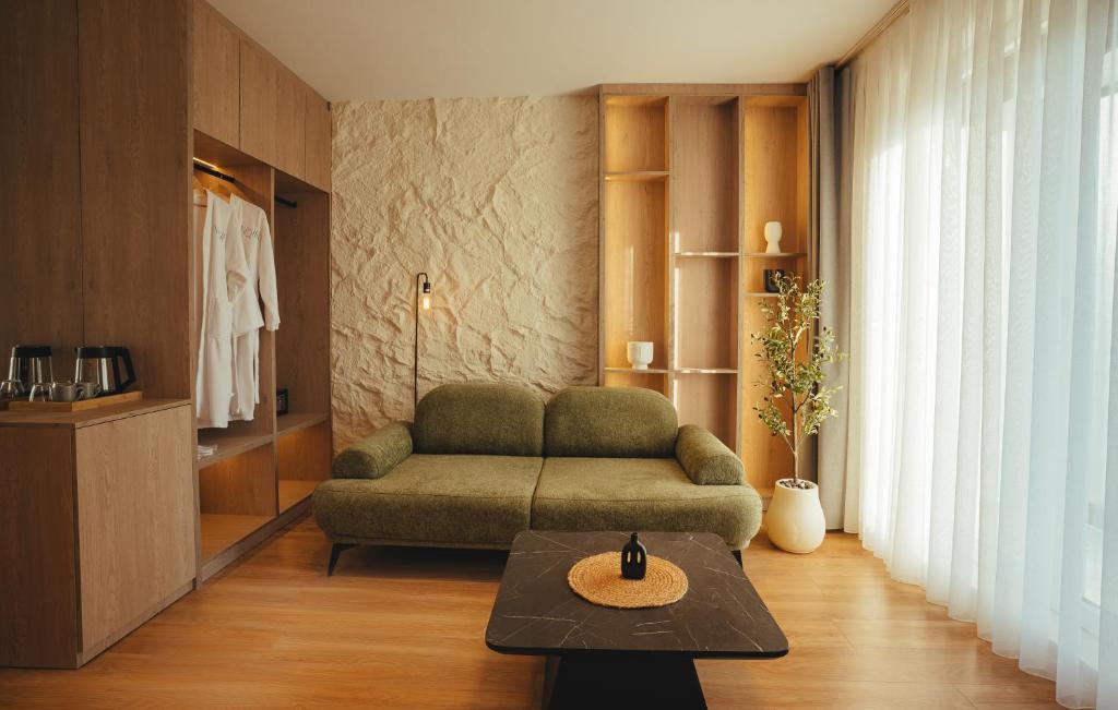 Lounge corner with sofa, robes and coffee station